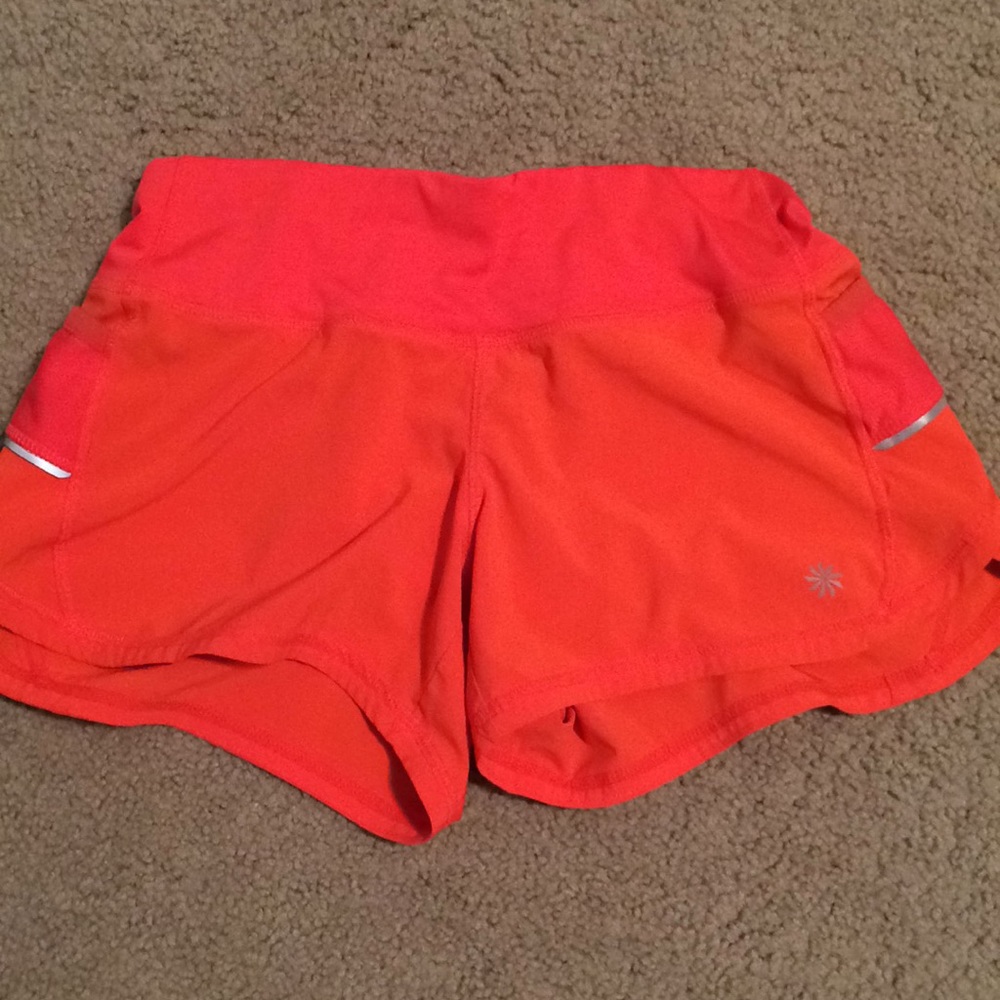 Athleta orange running shorts xxs